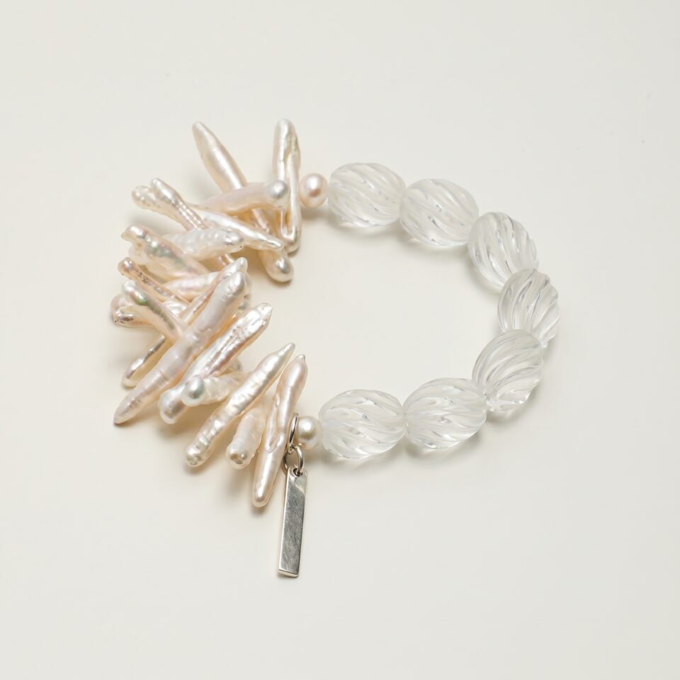 Clear Crystal & Cultured Pearl Bracelet photographed on a pale background