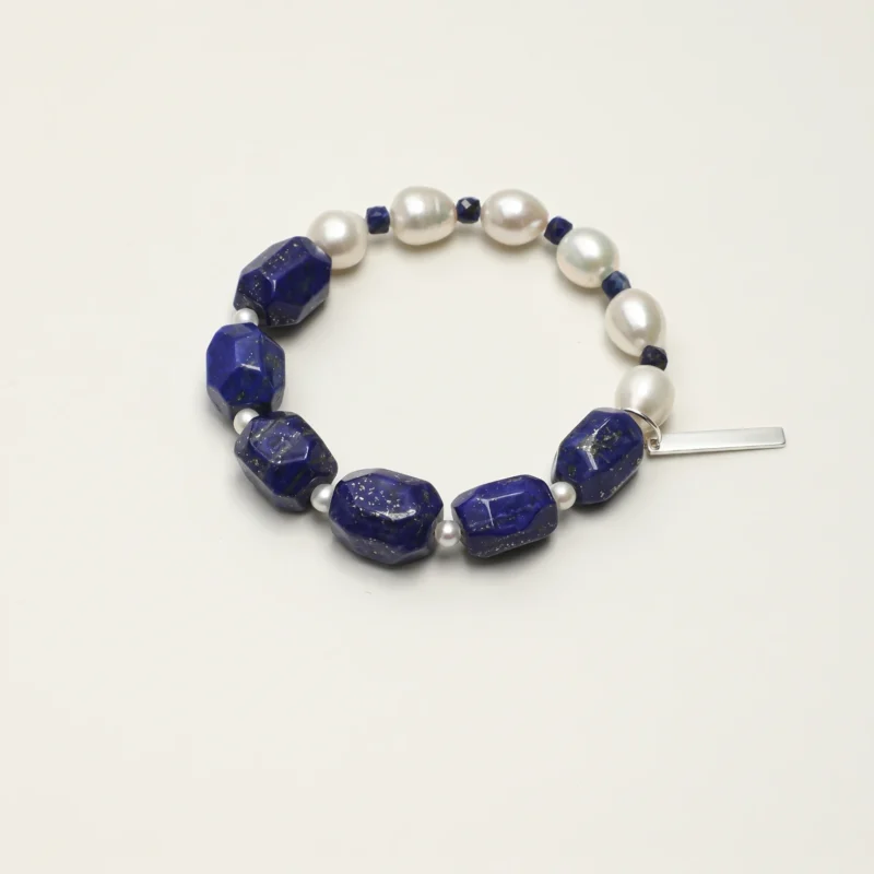 Lapis Lazuli & Cultured Pearl Bracelet photographed on a pale background
