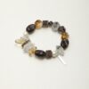 Clear Quartz, Smoky Quartz, Citrine & Cultured Pearl Bracelet photographed on a pale background