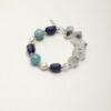 Lapis Lazuli, Amazonite & Cultured Pearl Bracelet photographed on a pale background