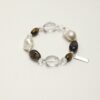 Clear Quartz, Smoky Quartz, Tiger’s Eye & Cultured Pearl Bracelet photographed on a pale background