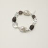 Clear Quartz, Smoky Quartz & Cultured Pearl Bracelet photographed on a pale background