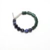 Malachite, Blue-Veined Stone & Cultured Pearl Bracelet photographed on a pale background