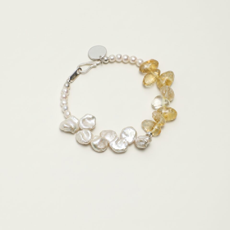 Citrine & Cultured Pearl Bracelet photographed on a pale background