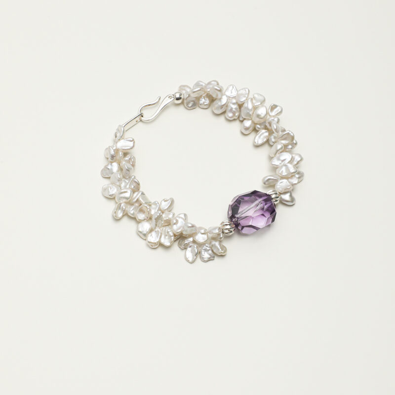 Amethyst & Cultured Pearl Bracelet photographed on a pale background