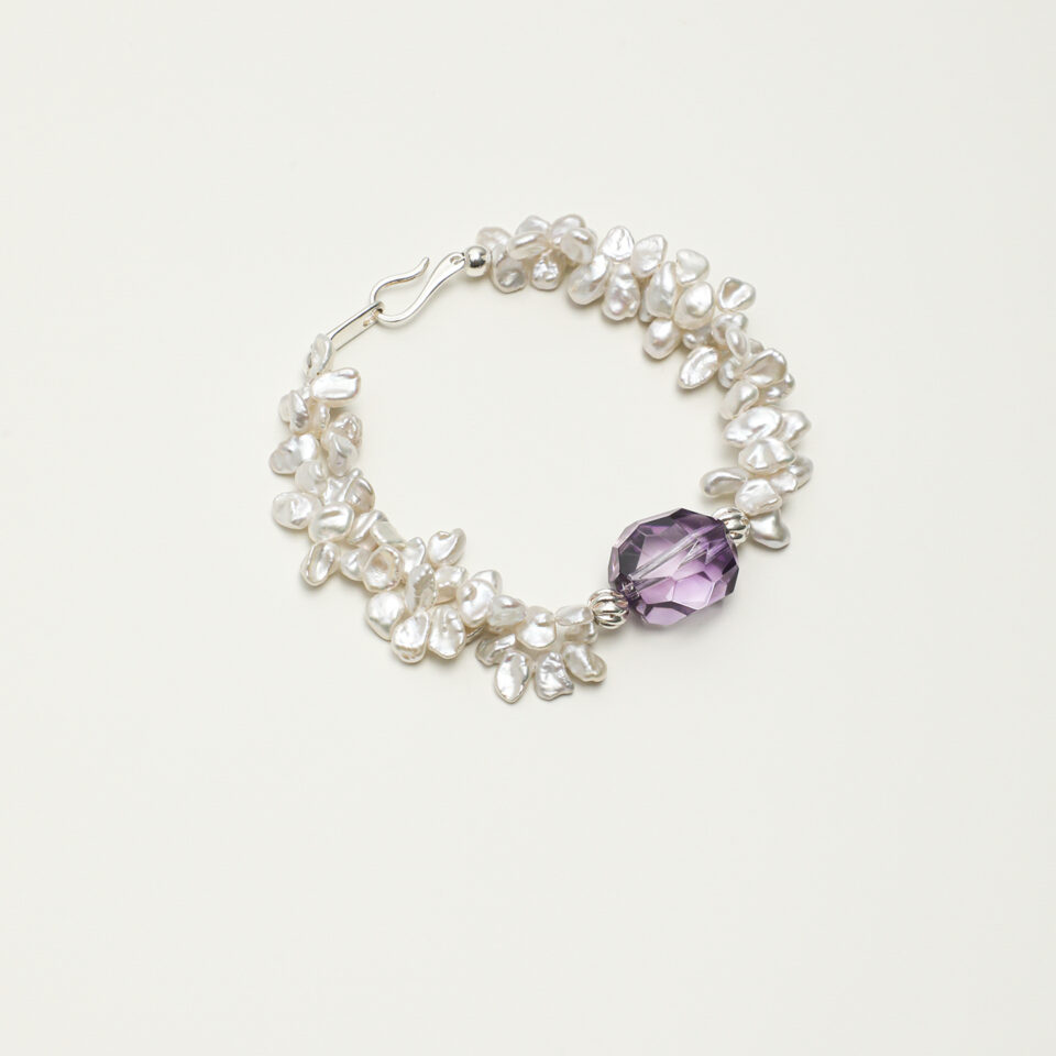 Amethyst & Cultured Pearl Bracelet photographed on a pale background