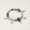 Clear Quartz, Amethyst & Cultured Pearl Bracelet photographed on a pale background