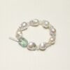 Fluorite, Prehnite & Cultured Pearl Bracelet photographed on a pale background