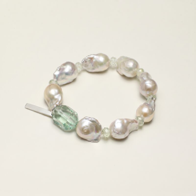 Fluorite, Prehnite & Cultured Pearl Bracelet photographed on a pale background