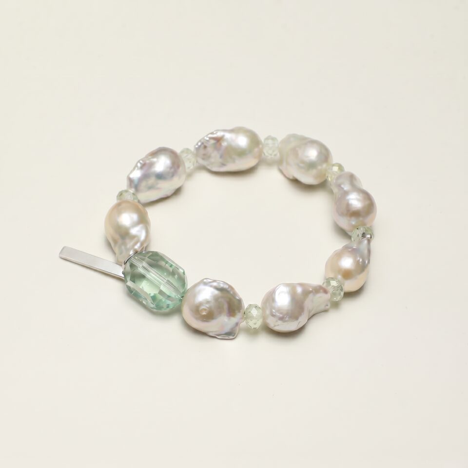 Fluorite, Prehnite & Cultured Pearl Bracelet photographed on a pale background