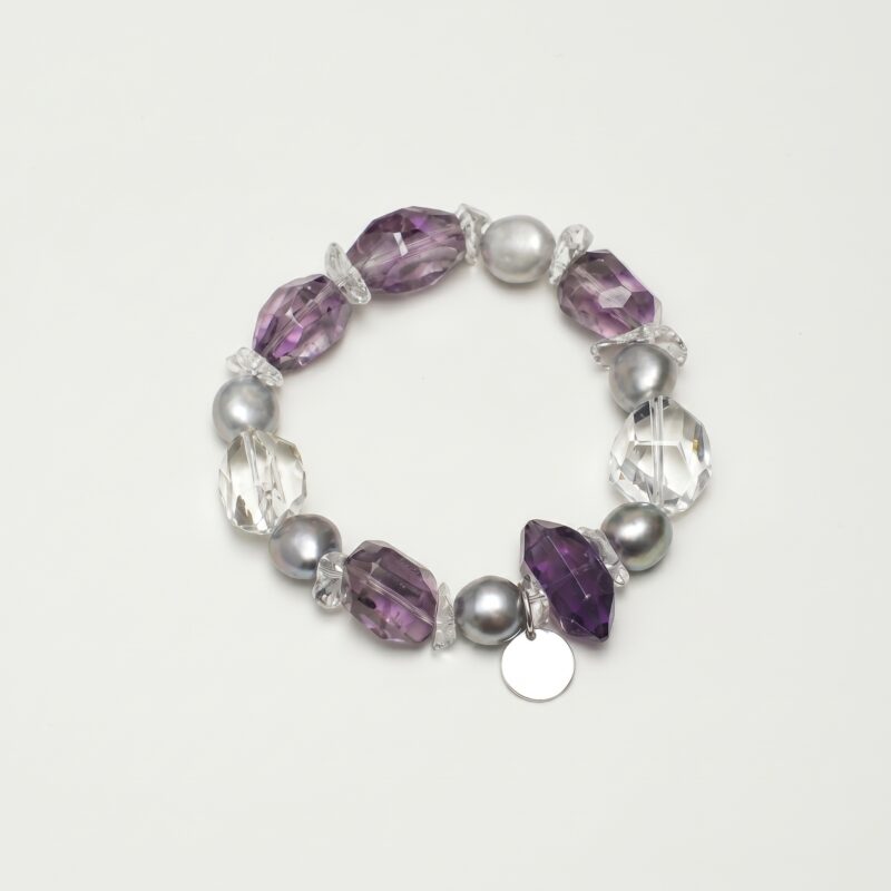 Clear Quartz, Amethyst & Cultured Pearl Bracelet photographed on a pale background