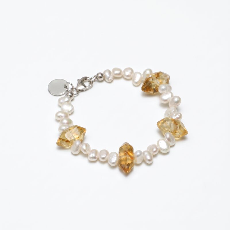 Yellow Quartz & Cultured Pearl Bracelet photographed on a pale background