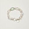 Clear Quartz, Fluorite & Cultured Pearl Bracelet photographed on a pale background