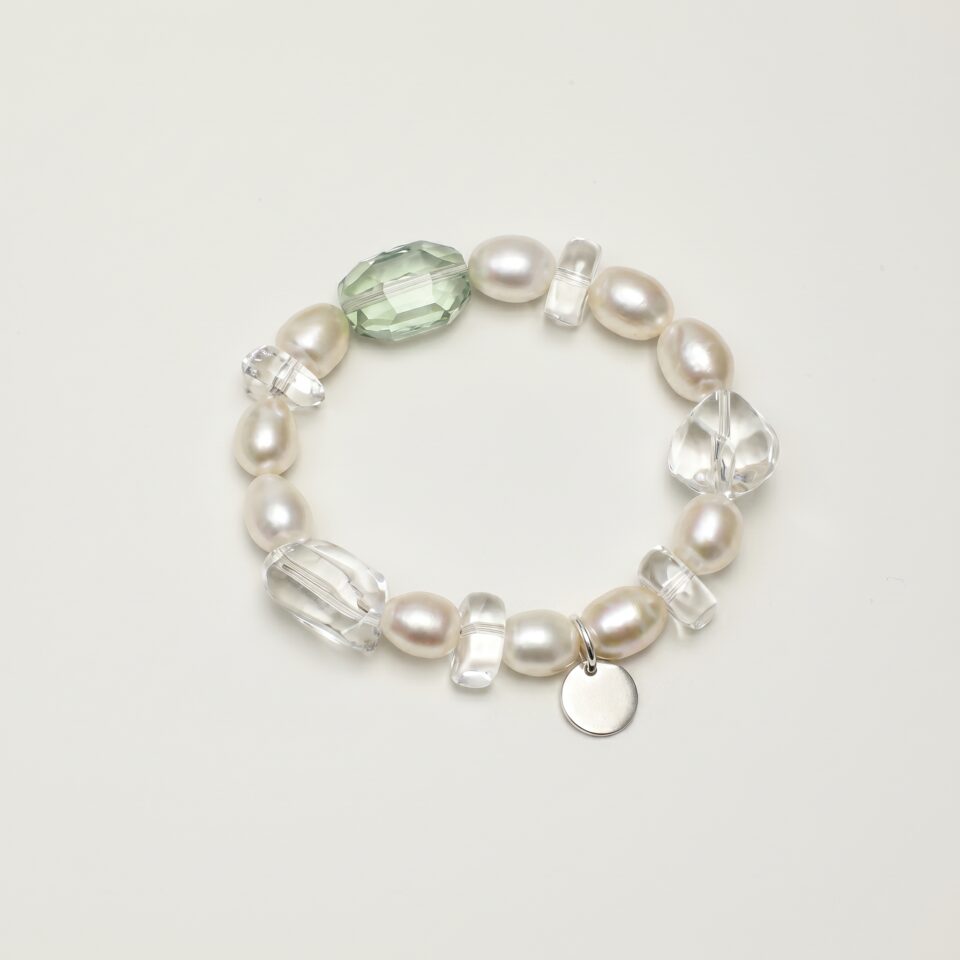 Clear Quartz, Fluorite & Cultured Pearl Bracelet photographed on a pale background