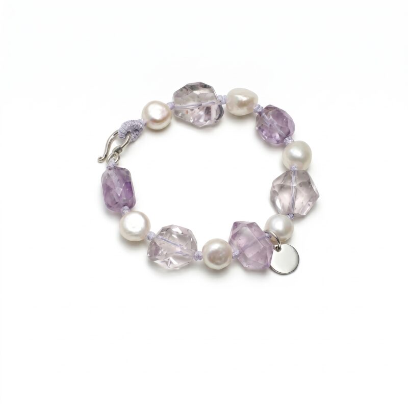 Clear Quartz, Amethyst & Cultured Pearl Bracelet photographed on a pale background