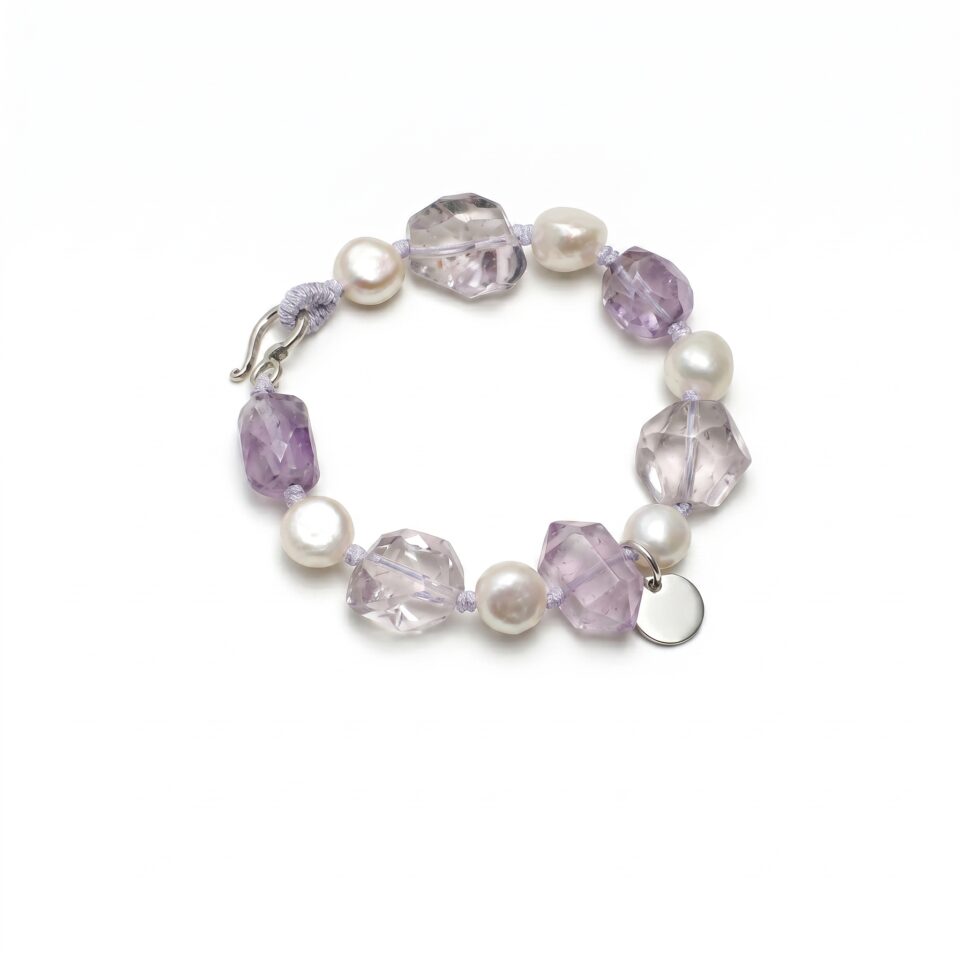 Clear Quartz, Amethyst & Cultured Pearl Bracelet photographed on a pale background