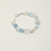 Clear Quartz, Aquamarine & Cultured Pearl Bracelet photographed on a pale background