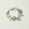 Citrine, Prehnite & Cultured Pearl Bracelet photographed on a pale background