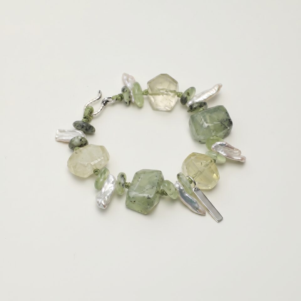 Citrine, Prehnite & Cultured Pearl Bracelet photographed on a pale background