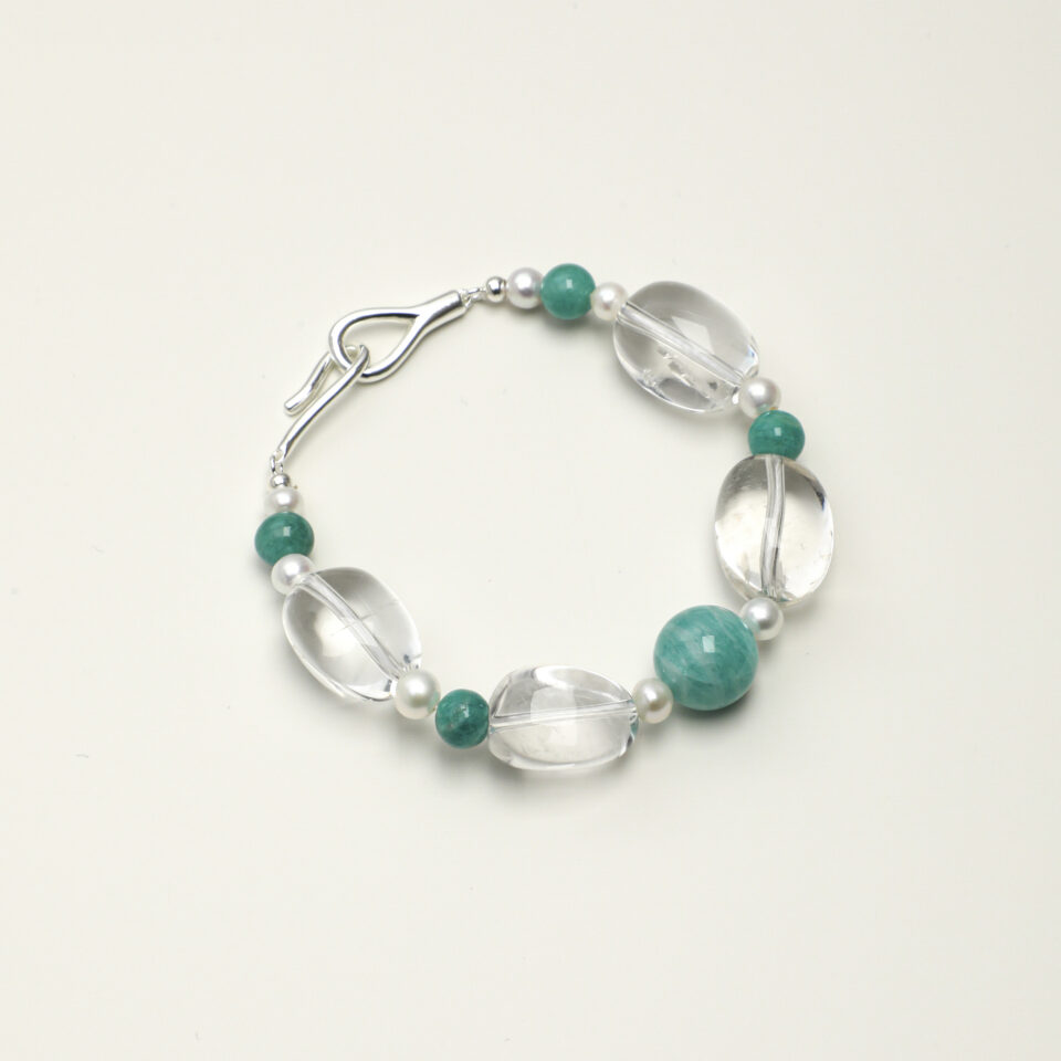 Clear Quartz, Amazonite & Cultured Pearl Bracelet photographed on a pale background