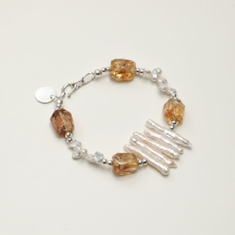 Citrine & Cultured Pearl Bracelet photographed on a pale background