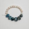 Blue Apatite & Cultured Pearl Bracelet photographed on a pale background