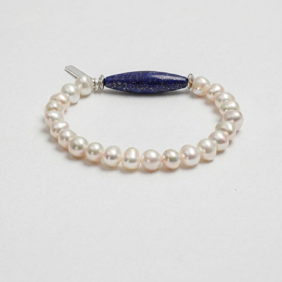 Lapis Lazuli & Cultured Pearl Bracelet photographed on a pale background