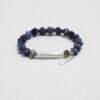 Blue-Veined Stone & Cultured Pearl Bracelet photographed on a pale background