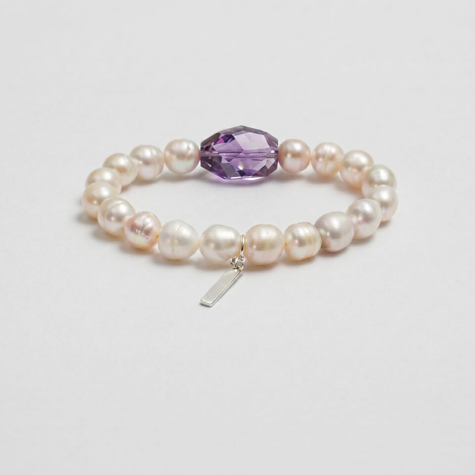 Amethyst & Cultured Pearl Bracelet photographed on a pale background