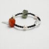 Clear Quartz, Agate, Tourmaline & Cultured Pearl Bracelet photographed on a pale background