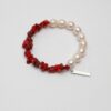 Red Coral & Cultured Pearl Bracelet photographed on a pale background