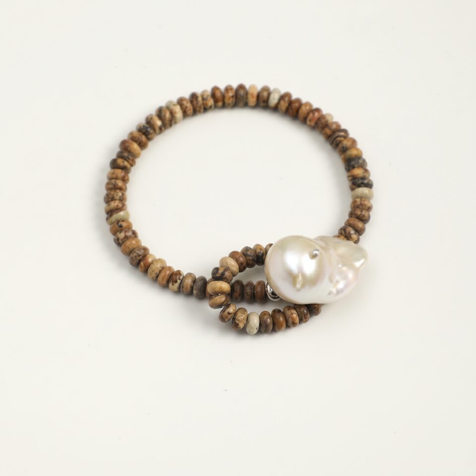 Wood-Grain Stone & Cultured Pearl Bracelet photographed on a pale background