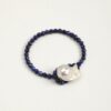 Lapis Lazuli & Cultured Pearl Bracelet photographed on a pale background