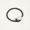 Malachite & Cultured Pearl Bracelet photographed on a pale background