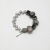 Agate, Rutilated Quartz & Cultured Pearl Bracelet photographed on a pale background
