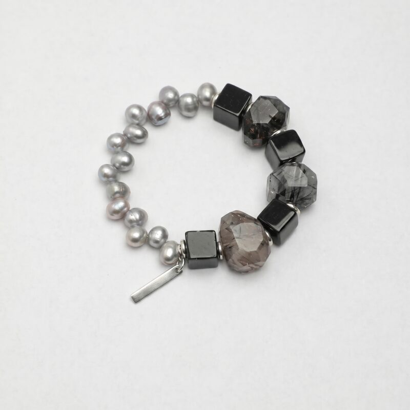 Agate, Rutilated Quartz & Cultured Pearl Bracelet photographed on a pale background