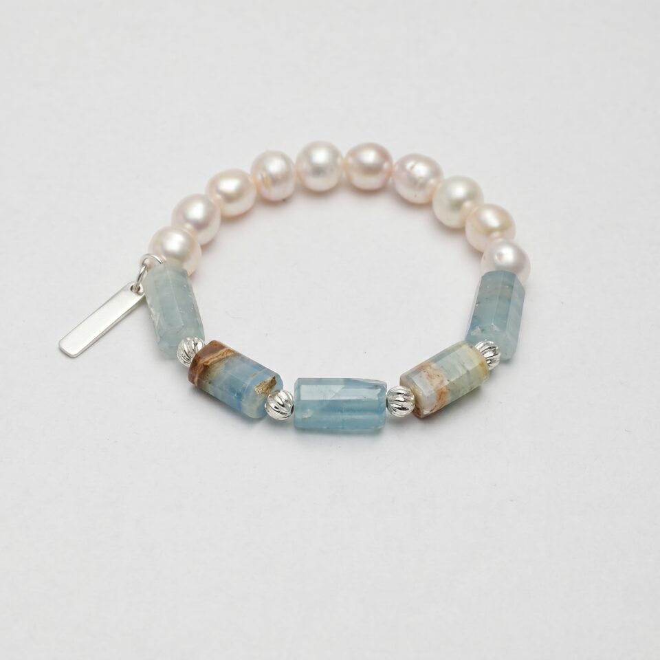 Blue Stone & Cultured Pearl Bracelet photographed on a pale background