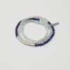 Triple-Strand Lapis Lazuli, Aquamarine & Cultured Pearl Bracelet photographed on a pale background