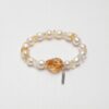 Citrine & Cultured Pearl Bracelet photographed on a pale background