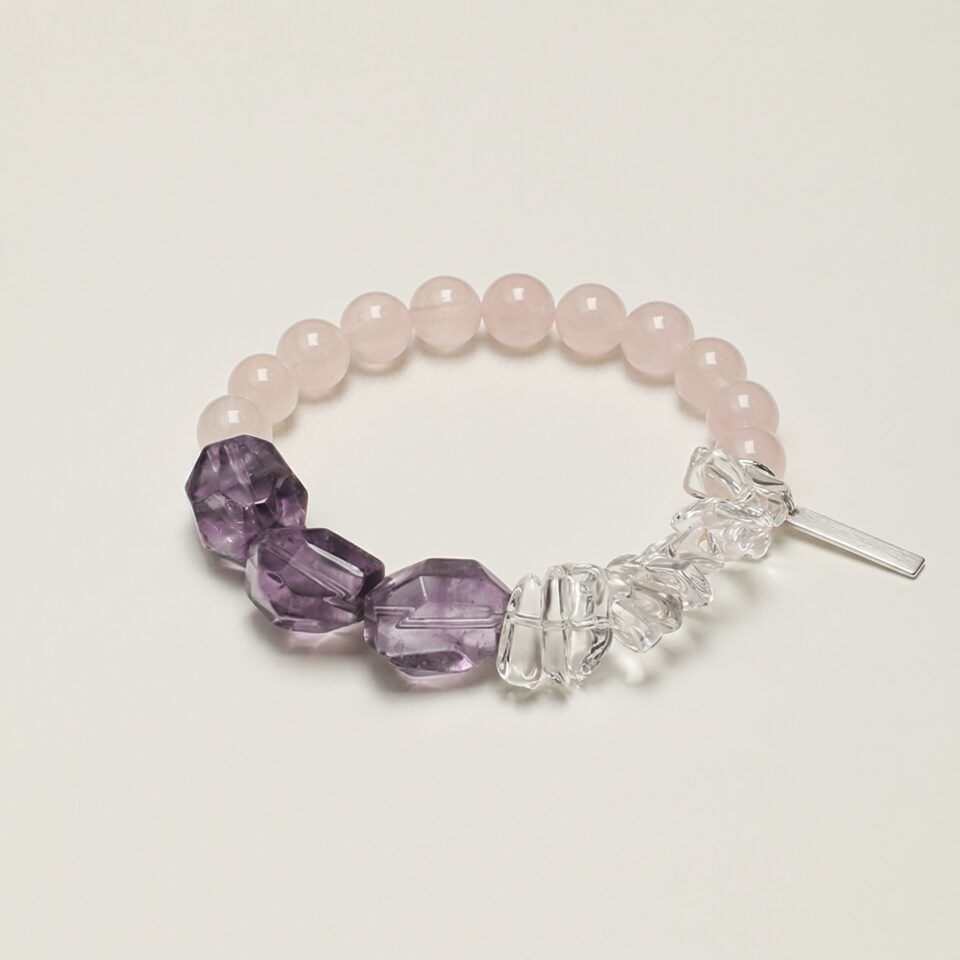 Rose Quartz & Amethyst Bracelet photographed on a pale background