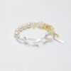 Clear Quartz & Citrine Bracelet photographed on a pale background
