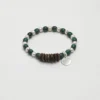Malachite & Cultured Pearl Bracelet photographed on a pale background