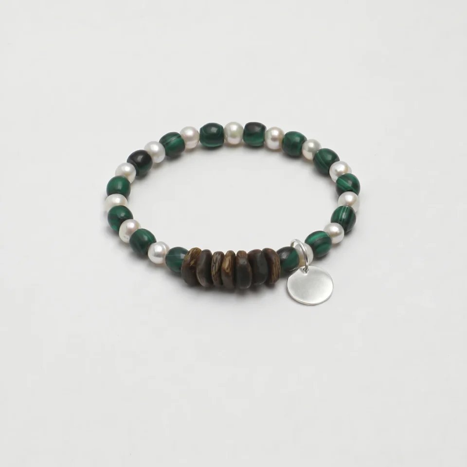 Malachite & Cultured Pearl Bracelet photographed on a pale background