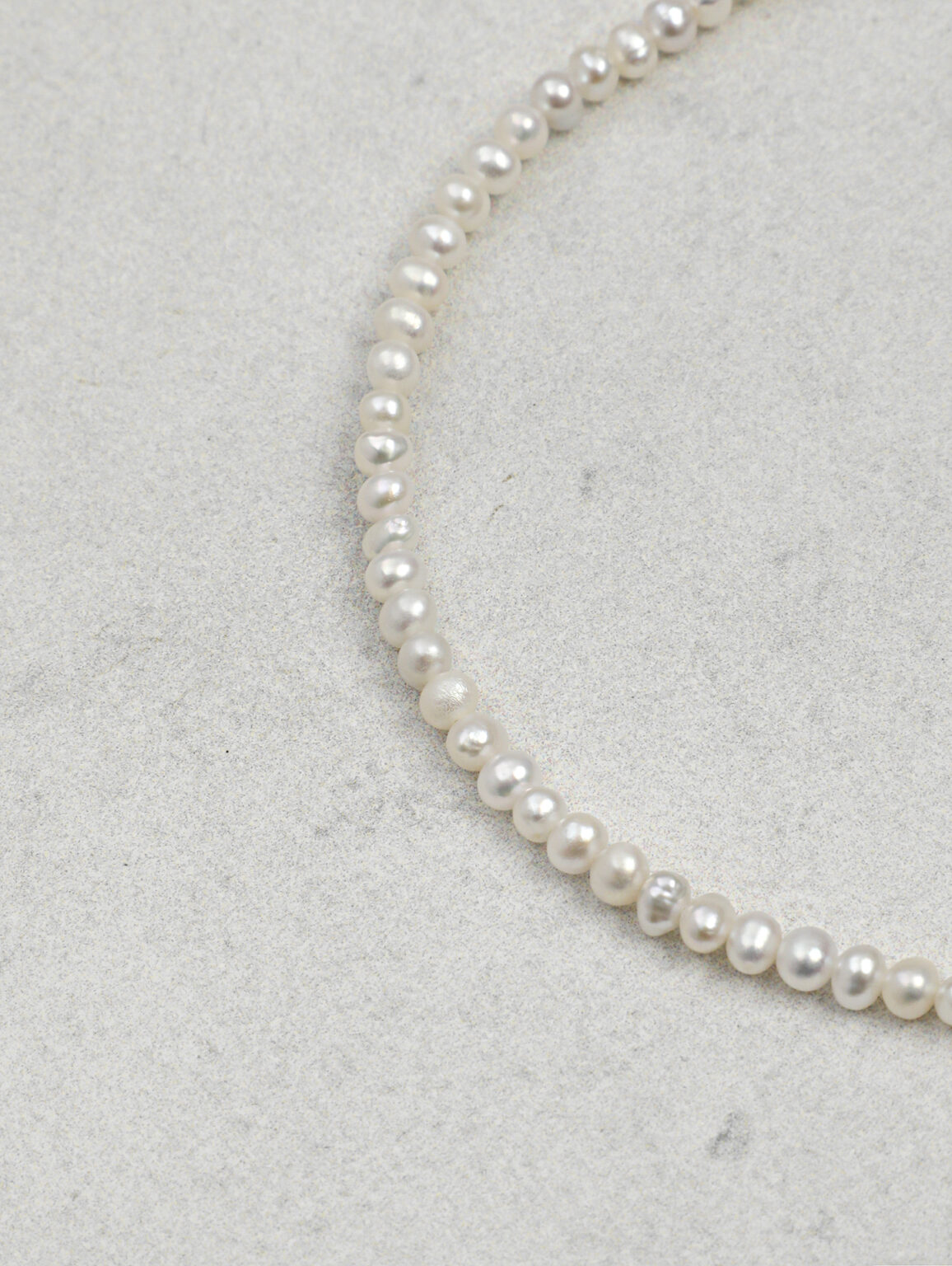 Close view of small cultured pearls in a bracelet