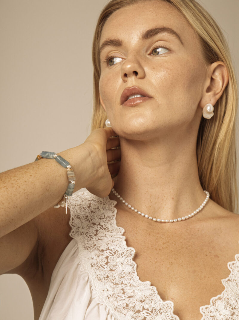 Aura & Qi lifestyle PURAERIA0939 Blue Stone & Cultured Pearl Bracelet in an original styled photograph