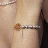 Aura & Qi lifestyle PURAERIA1598 Citrine & Cultured Pearl Bracelet in an original styled photograph